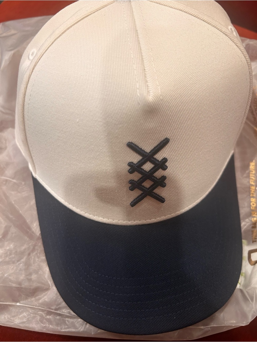 RHONE Two-Tone off White and Navy Baseball Cap trucker hat